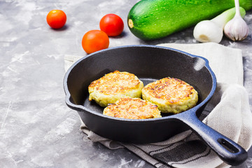 Vegetarian feta zucchini fritters. Selective focus, copy space.
