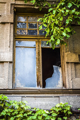 Broken glass of a window of an apartment house.