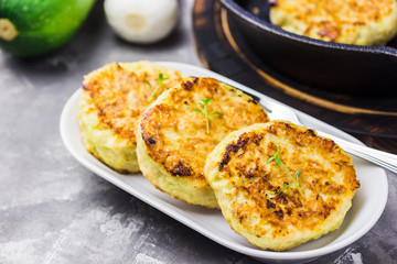 Vegetarian feta zucchini fritters.  Selective focus, space for text.