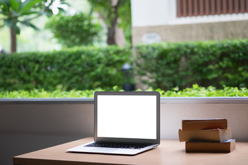 Computer laptop and old vintage book