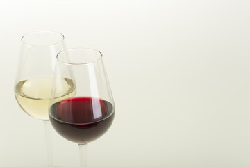Glasses of wine on white background