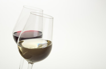 Glasses of wine on white background