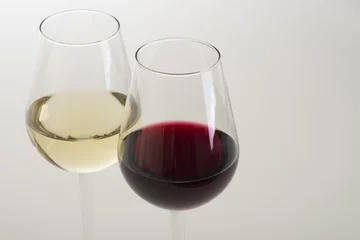 Fotobehang Glasses of wine on white background © AG Photo Design