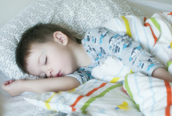 Sleeping baby in bed.