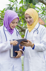Two medical student having discussion in the park