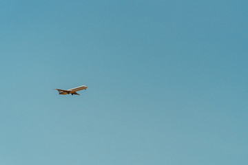 Airplane On Clear Blue Summer Sky