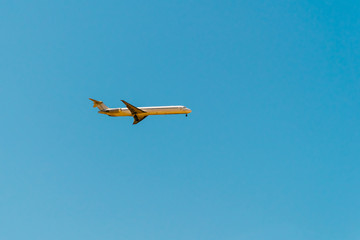 Airplane On Clear Blue Summer Sky