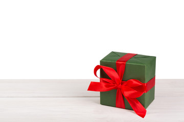 Birthday holiday gift box in wrapping paper on white wood