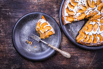 Apple pie on rustic background.