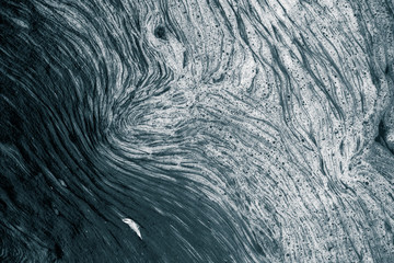 An abstract pattern of a foam forming in the river. Beautiful abstract monochrome background pattern.