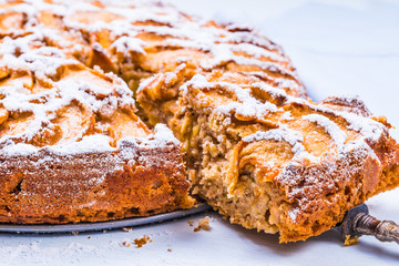Apple pie on rustic background.