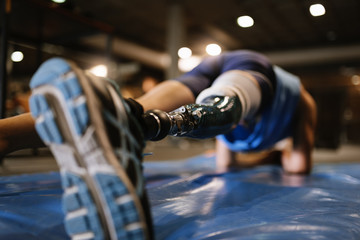 Disabled young man training in the gym