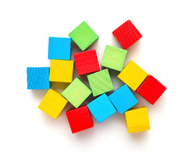 top view colorful square wooden toy blocks on a white background