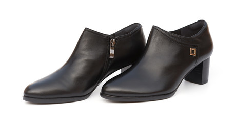 pair of trendy black shoes for lady on a white background
