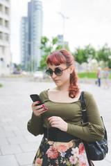 young woman beautiful outdoor using smart phone - technology, social network, communication concept