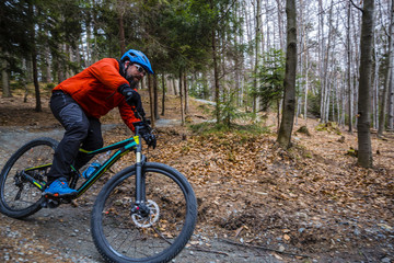 Fototapeta na wymiar Cycling in autumn mountains forest landscape. Man cycling MTB enduro flow trail track. Outdoor sport activity.