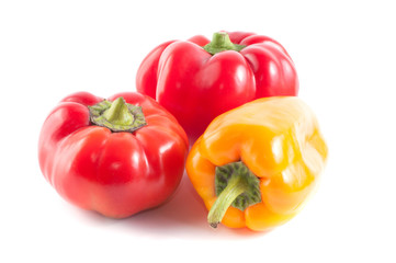 Red and yellow peppers on a white background