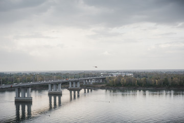 Fototapeta na wymiar The bridge through the river. Bolshoy Bridge through the river. Krasivy Bridge through the river.
