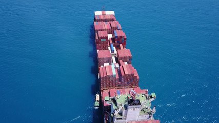 large huge container ship fully loaded at sea aerial shot