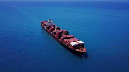 large huge container ship fully loaded at sea aerial shot