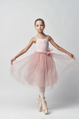 Fototapeta na wymiar little ballerina on a white background