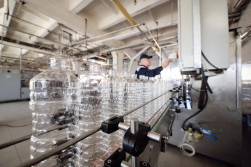 Bottle. Industrial production of PET bottles. Transparent packaging for food products