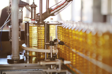 Sunflower oil production plant. The line of bottling of vegetable oil in plastic bottles.