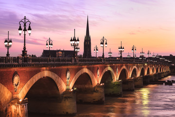 Pont de Pierre bridge at twulight, Bordeaux, France