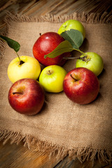 Fresh red apples in the wooden box. On wooden background. Free space for text . Top view