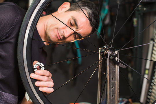 Male technician repairing a bike