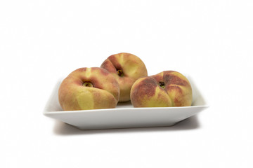 Peaches On A Plate Isolated On White Background
