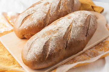 loaf of black bread on a table