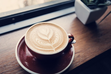 Cup of coffee on table, coffee cafe shop.