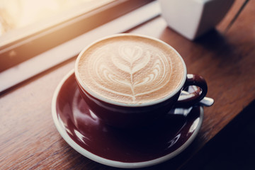 Cup of coffee on table, coffee cafe shop.