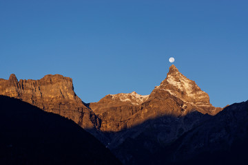 The Cime de l'Est at sunrise with the moon, Valais, Switzerland