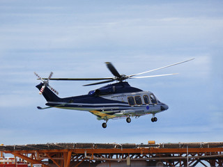 Helicopter or chopper land at oil and gas platform area for get and sent passenger from onshore...