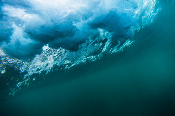 Blue wave texture underwater. Ocean in underwater