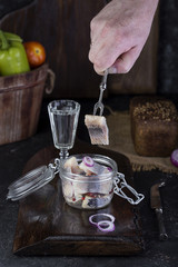 Marinated herring in a jar with onion