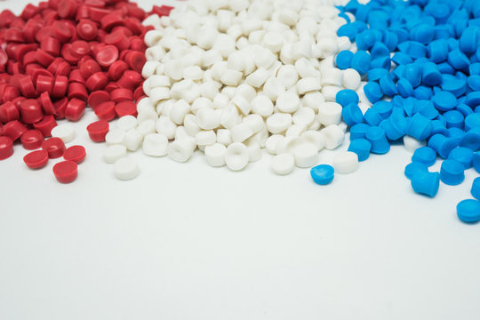 White Red And Blue Plastic Pellets. Colorant For Plastics.