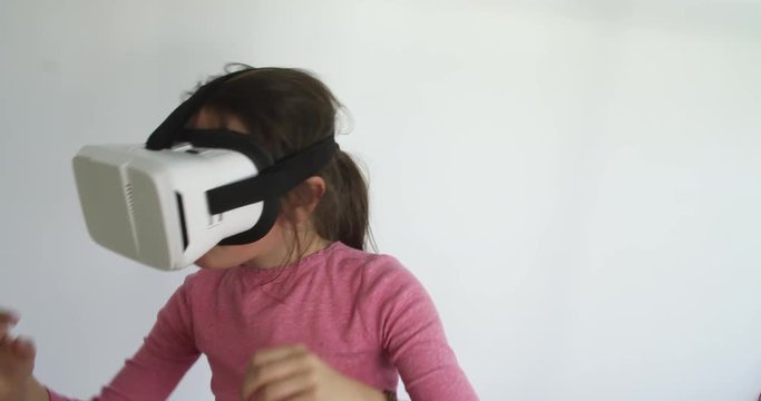 Girl acting out augmented world with VR headset.