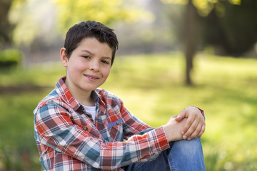 portrait of a casual teen boy, outdoors