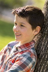 portrait of a casual teen boy, outdoors