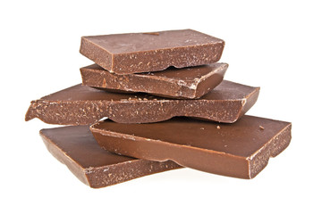 Pieces of milk chocolate on a white background