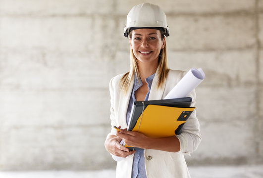 Portrait of female architect at the construction site.