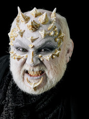 Naklejka premium Angry monster man baring teeth