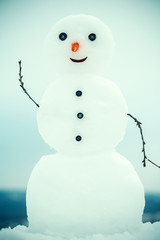 New year snowman from white snow outdoor.