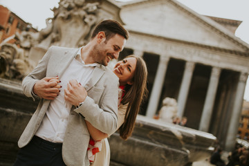 Happy loving couple, man and woman traveling on holidays in Rome, Italy