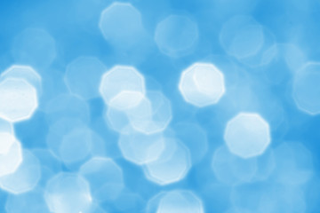 Abstract round  bokeh or glitter lights on blue background. Circles and defocused particles