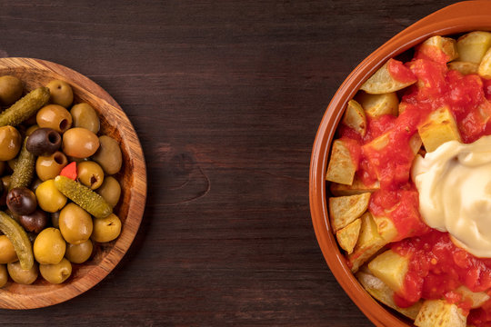 Patatas bravas and olives, Spanish tapas with copy space