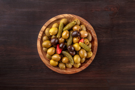 Overhead photo of pickled olives with copy space